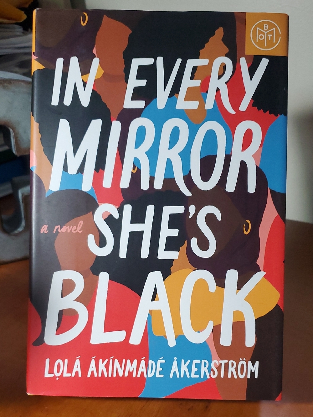 "In Every Mirror She's Black" by Lola Akinmade Akerstrom - Bold Multicolor Cover